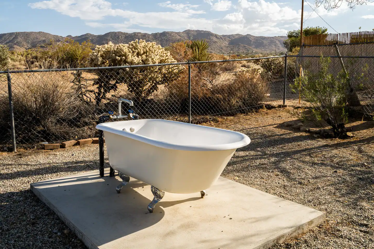 Outdoor clawfoot bathtub with desert view
