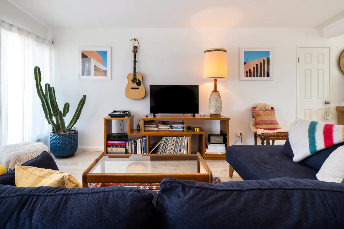 Living room with guitar on the wall